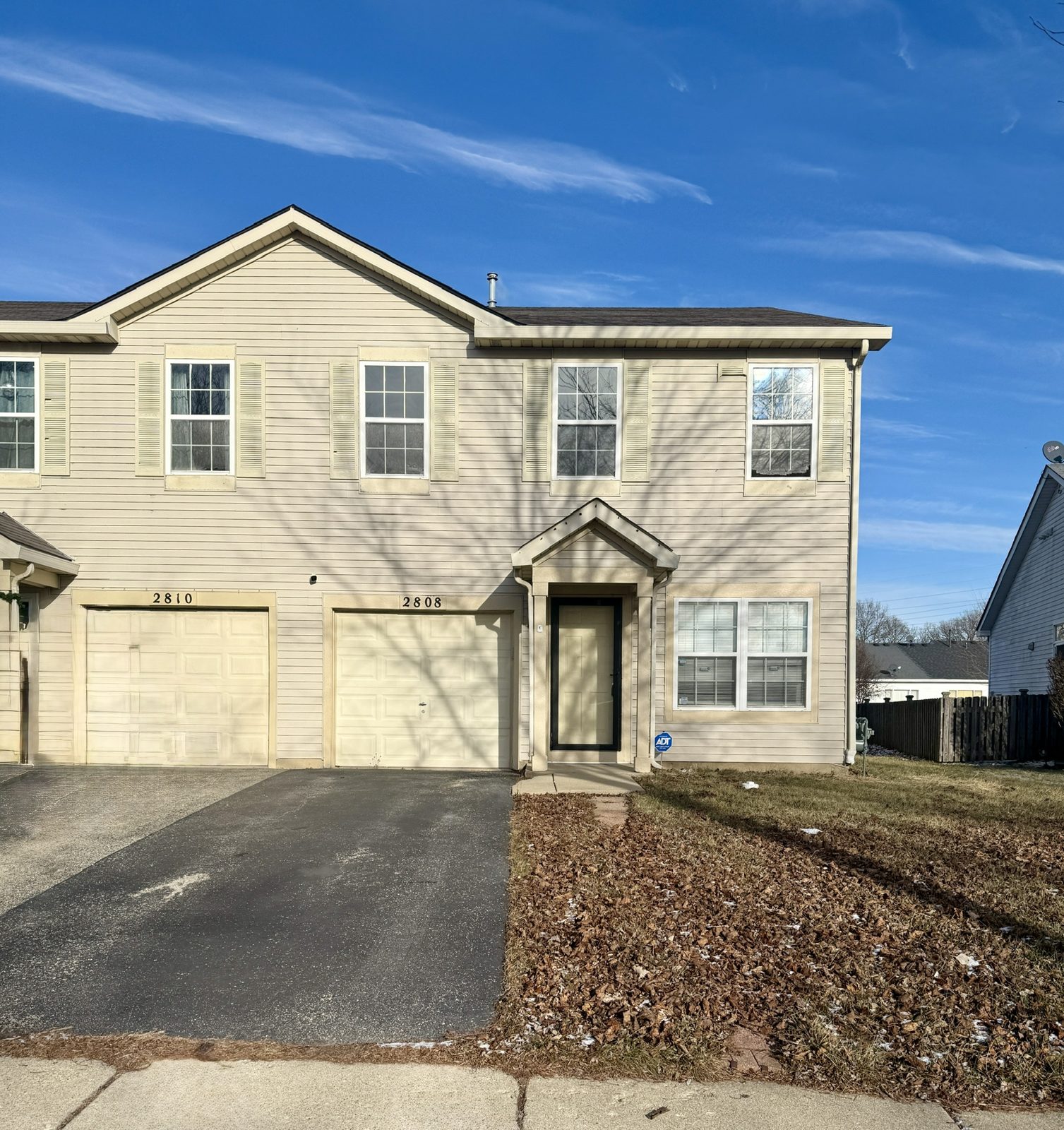 End-unit townhome in Plainfield, Illinois, photographed from the driveway